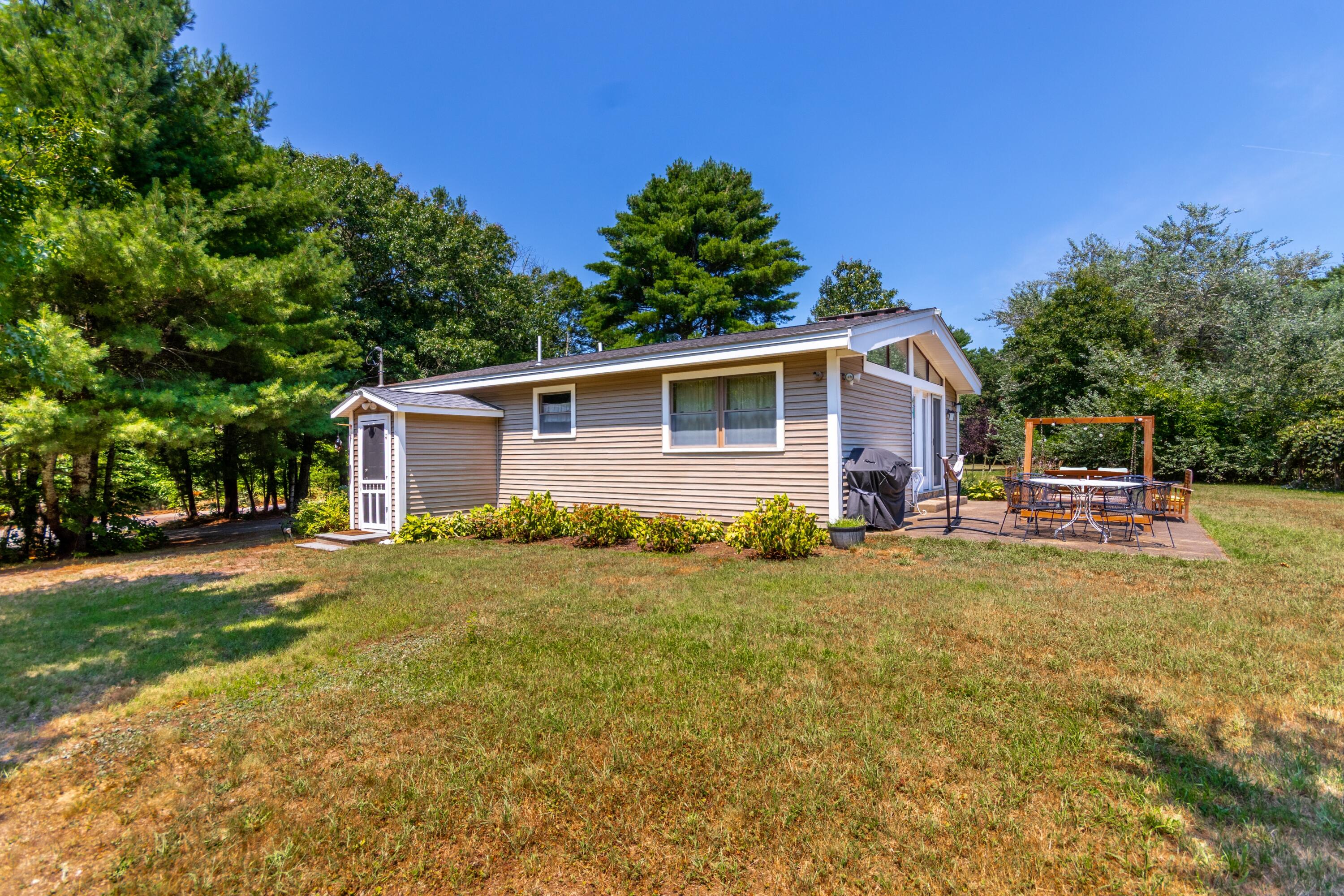 32 North Carver Road West Wareham, MA 02576 - Photo 26 of 42 a front view of house with yard and trees