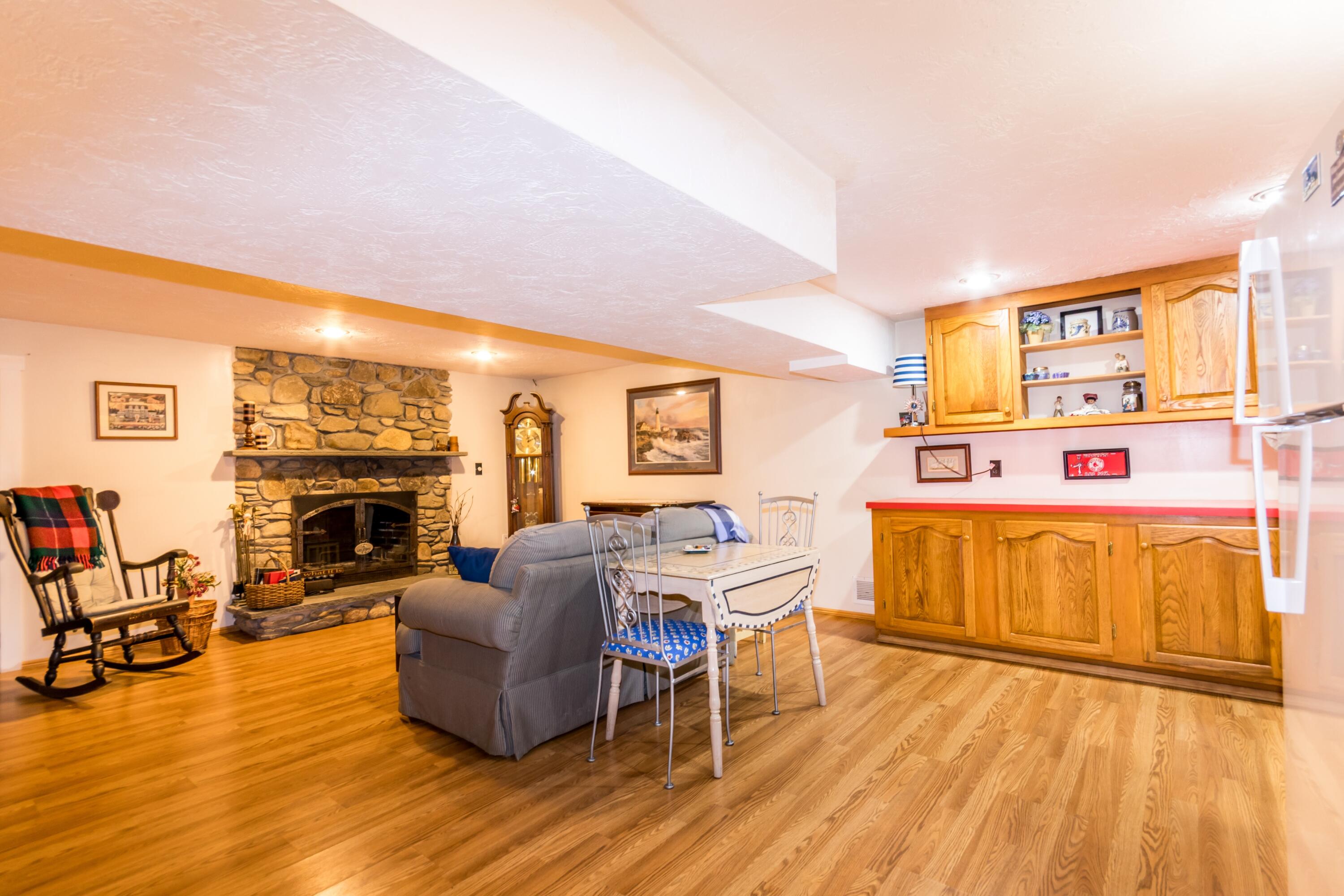 32 North Carver Road West Wareham, MA 02576 - Photo 29 of 42 a living room with furniture and a fireplace