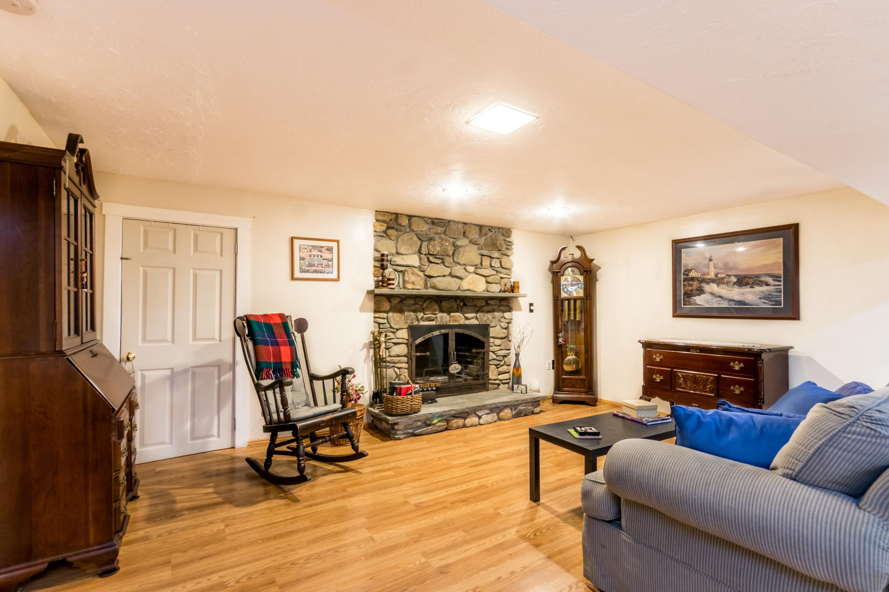 32 North Carver Road West Wareham, MA 02576 - Photo 30 of 42 a living room with furniture a fireplace and a flat screen tv