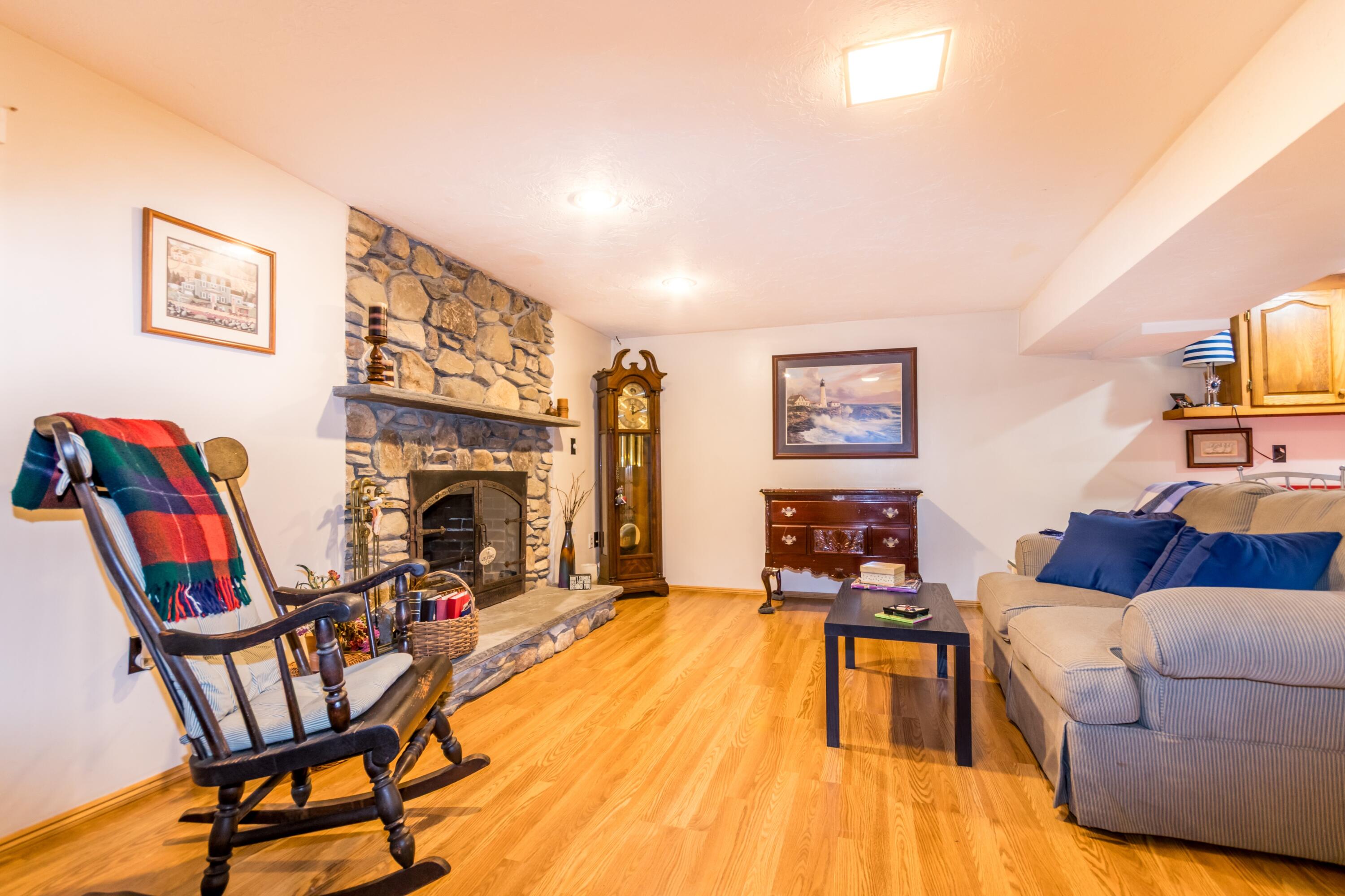 32 North Carver Road West Wareham, MA 02576 - Photo 32 of 42 a living room with furniture and a fireplace