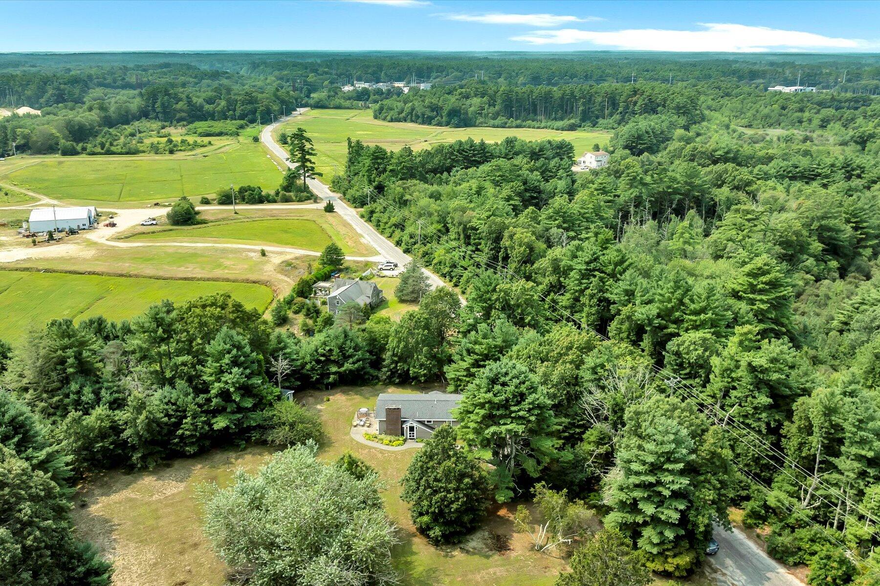 32 North Carver Road West Wareham, MA 02576 - Photo 37 of 42 a view of a water pond with green field