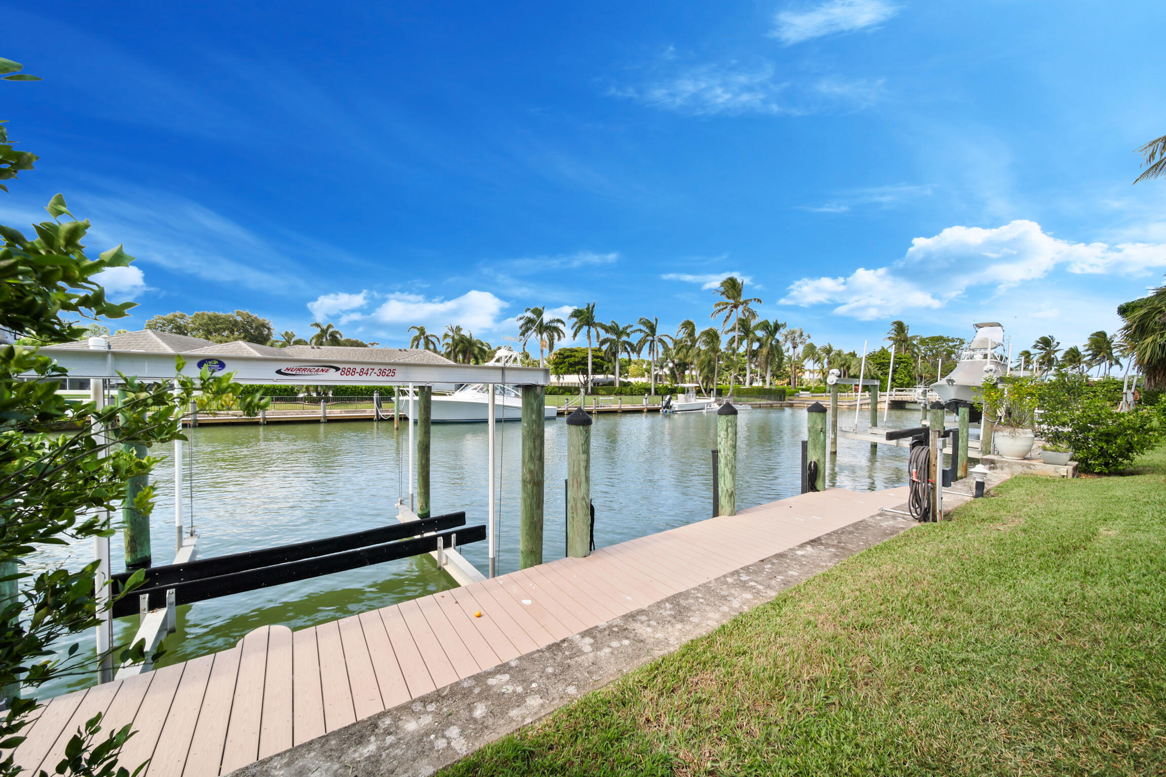 7 Island Road Sewall's Point, FL 34996 - Photo 11 of 70 a view of a lake with a house in the background