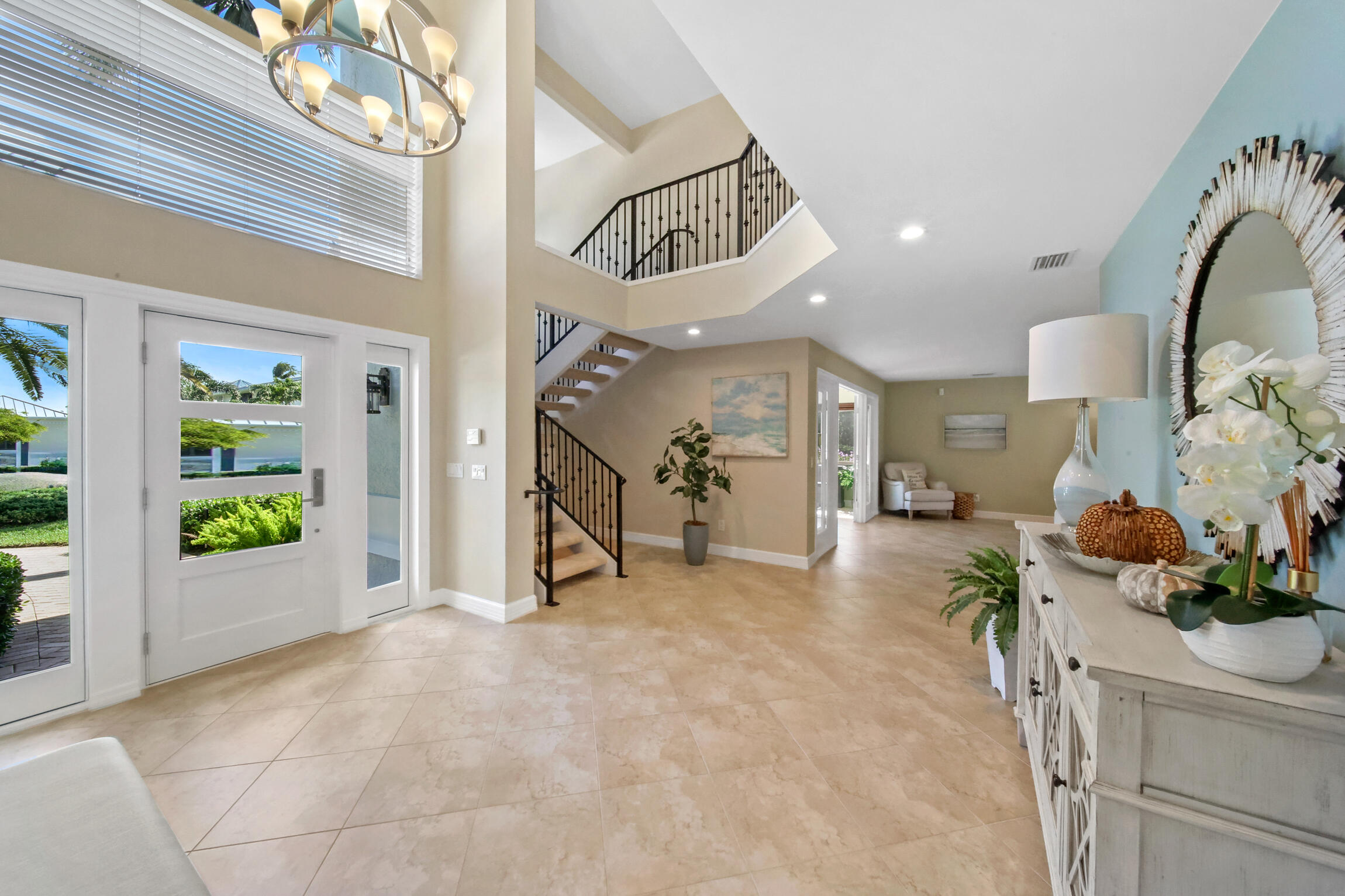 7 Island Road Sewall's Point, FL 34996 - Photo 17 of 70 a view of a hallway with workspace and a potted plant