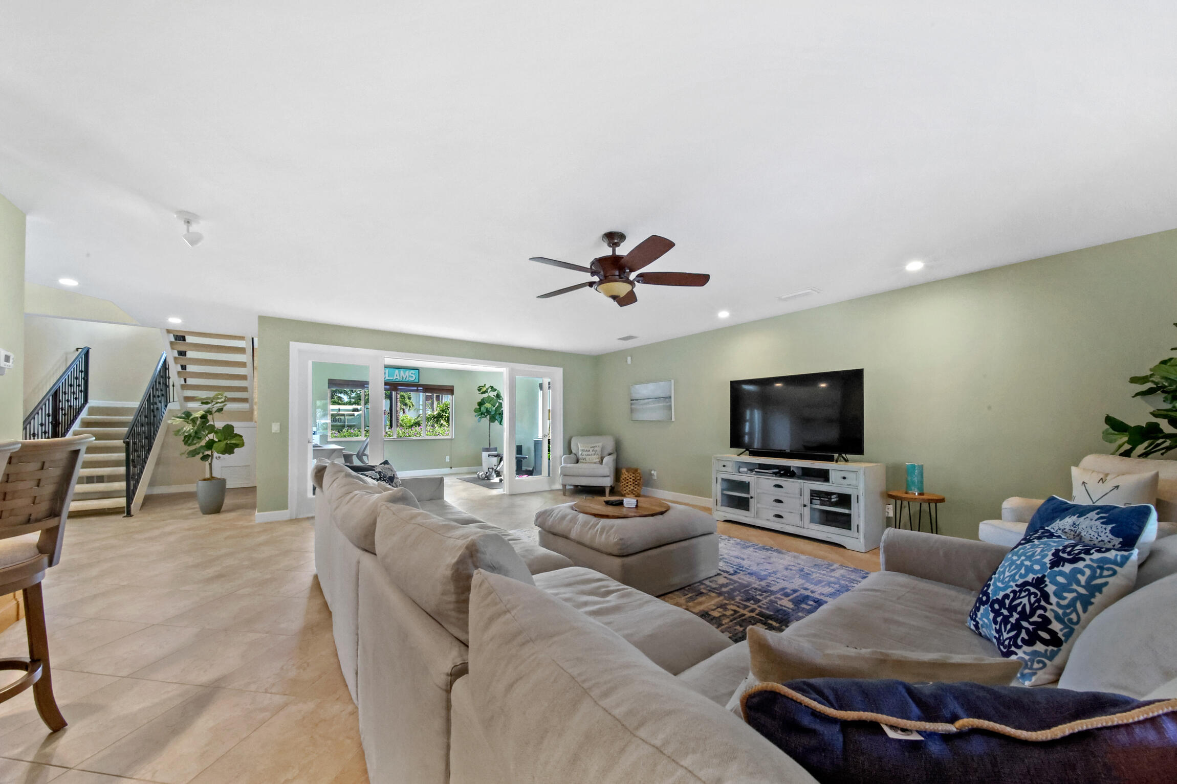 7 Island Road Sewall's Point, FL 34996 - Photo 26 of 70 a living room with furniture and a flat screen tv