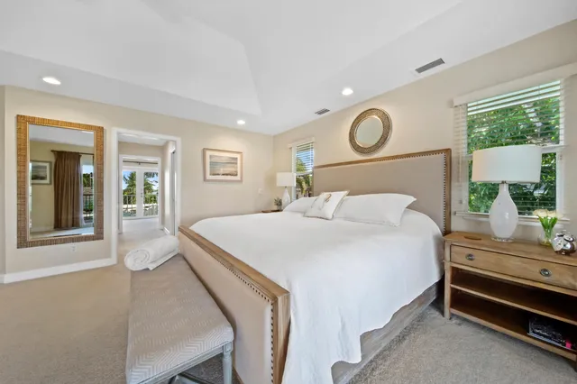 a bed room with a bed and a television