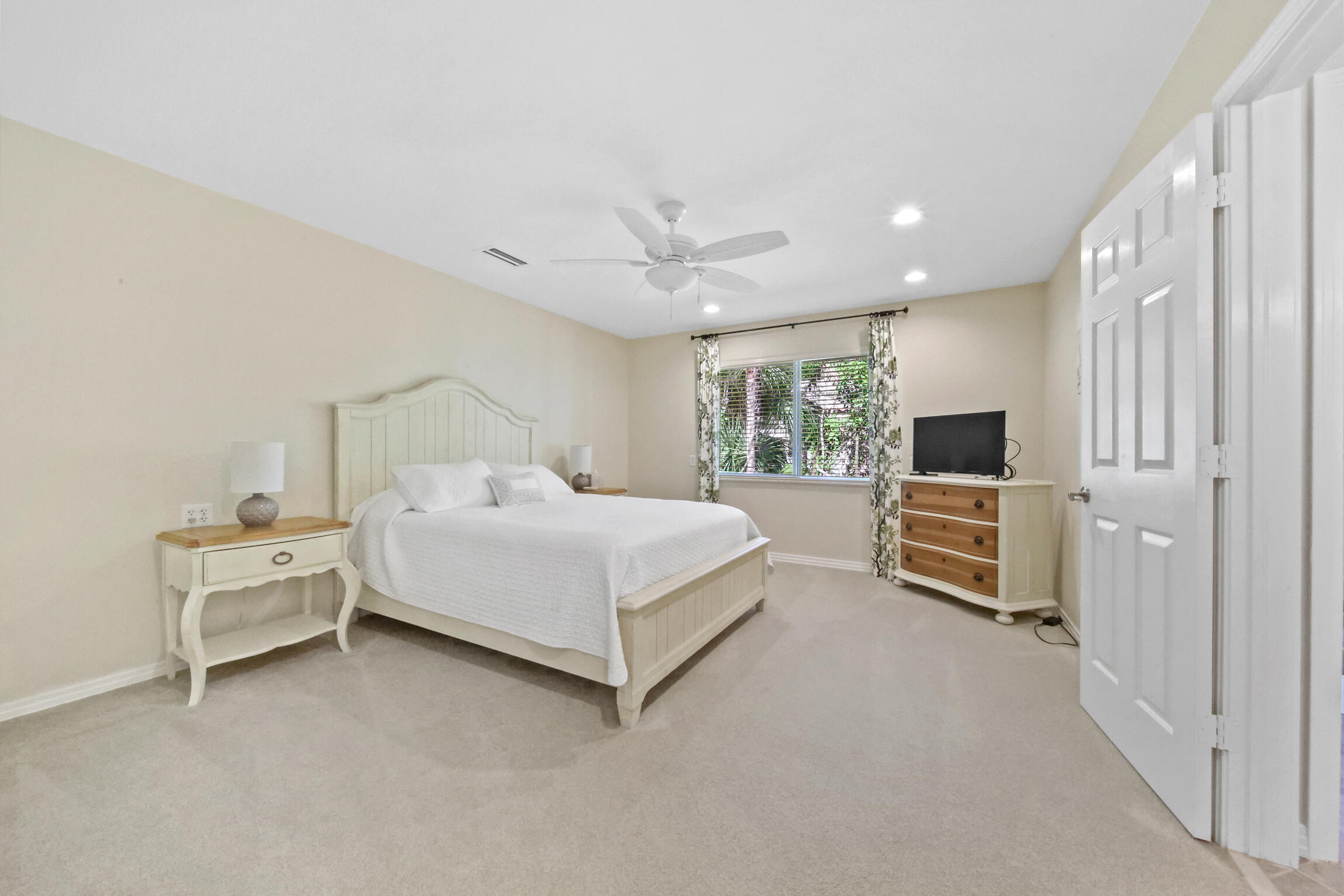 7 Island Road Sewall's Point, FL 34996 - Photo 41 of 70 a bedroom with a bed and a television