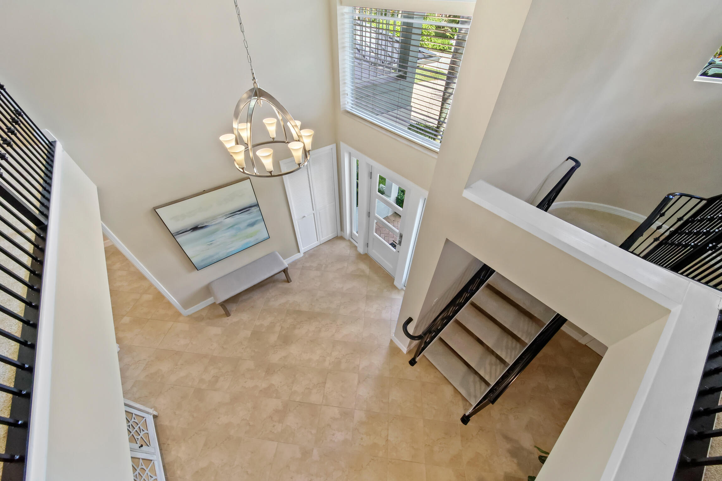 7 Island Road Sewall's Point, FL 34996 - Photo 42 of 70 a view of a livingroom with wooden floor and a chandelier
