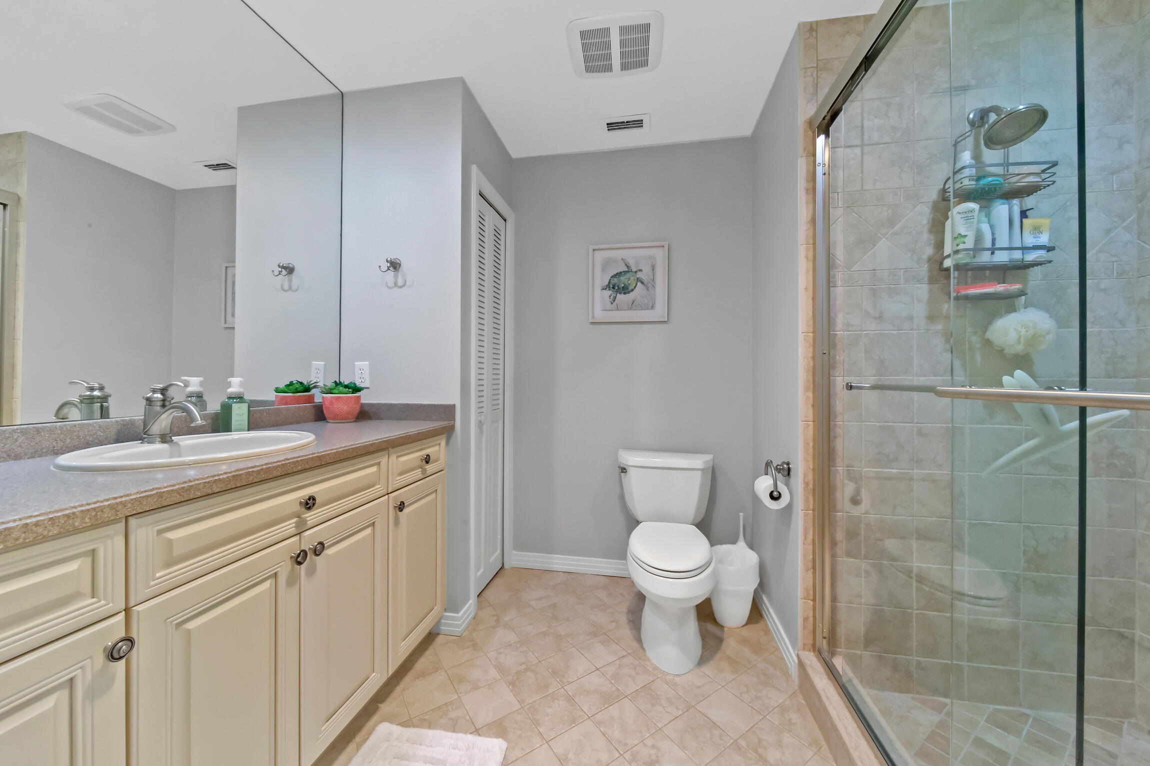 7 Island Road Sewall's Point, FL 34996 - Photo 45 of 70 a bathroom with a granite countertop sink a toilet and a mirror