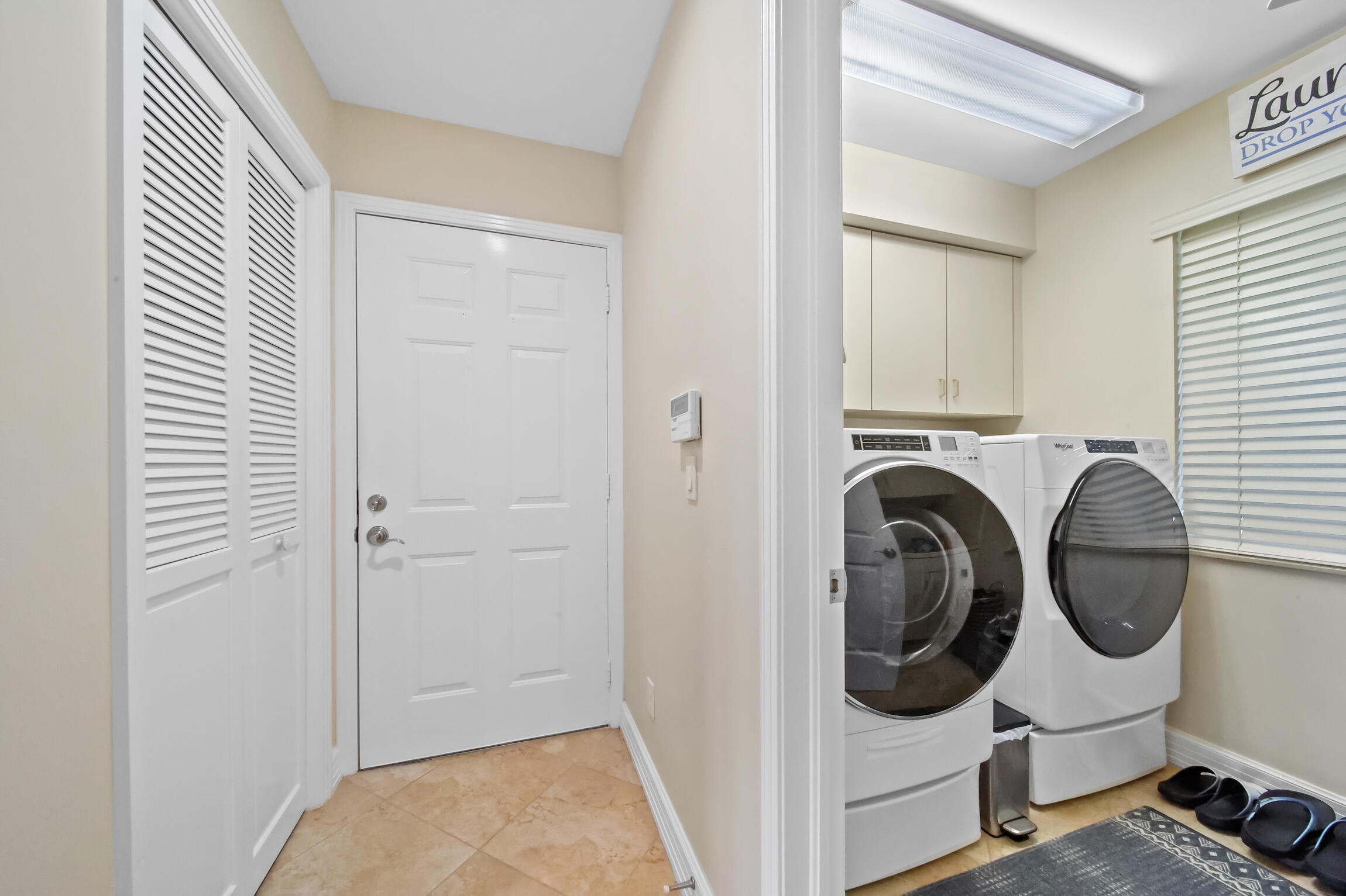 7 Island Road Sewall's Point, FL 34996 - Photo 48 of 70 a view of a storage & utility room with washer and dryer