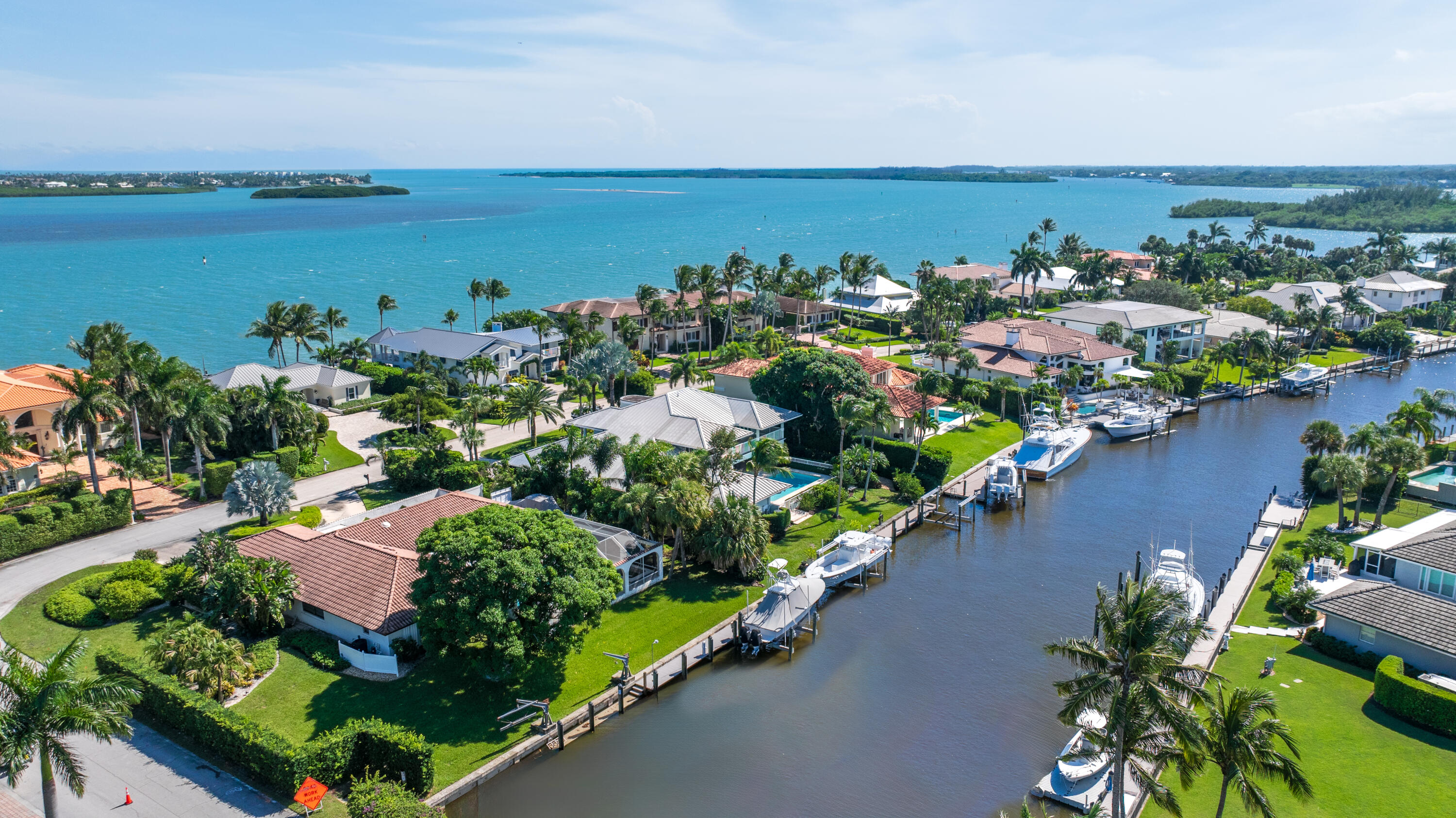 7 Island Road Sewall's Point, FL 34996 - Photo 66 of 70 an aerial view of a houses with a yard and lake view