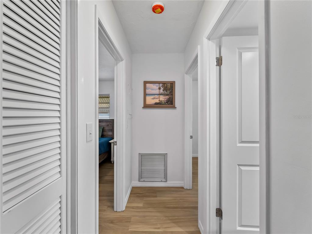 116 The Corso, Unit 116 Venice, FL 34285 - Photo 13 of 36 a view of a hallway with wooden floor