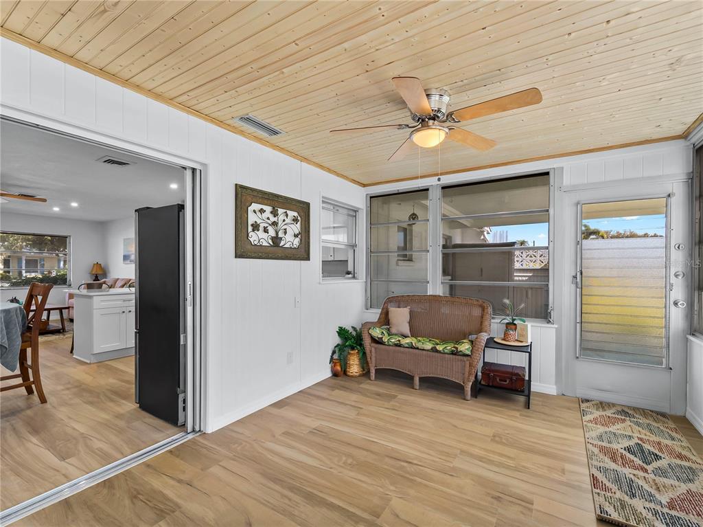 116 The Corso, Unit 116 Venice, FL 34285 - Photo 17 of 36 a living room with furniture and a ceiling fan