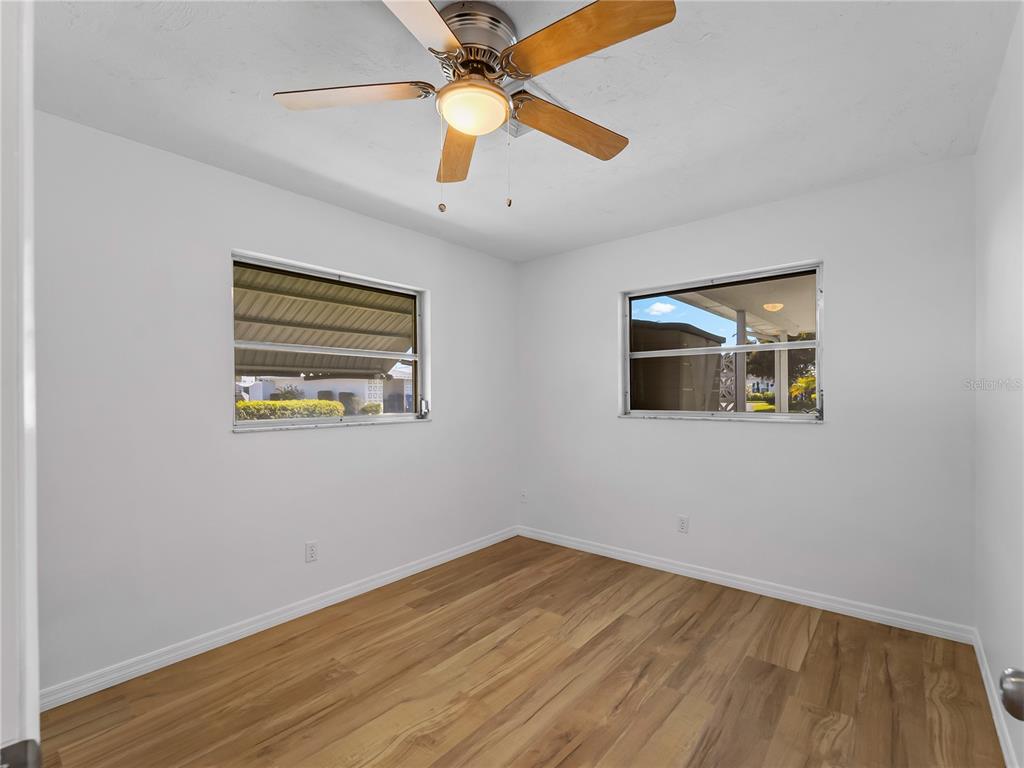 116 The Corso, Unit 116 Venice, FL 34285 - Photo 23 of 36 a view of empty room with wooden floor