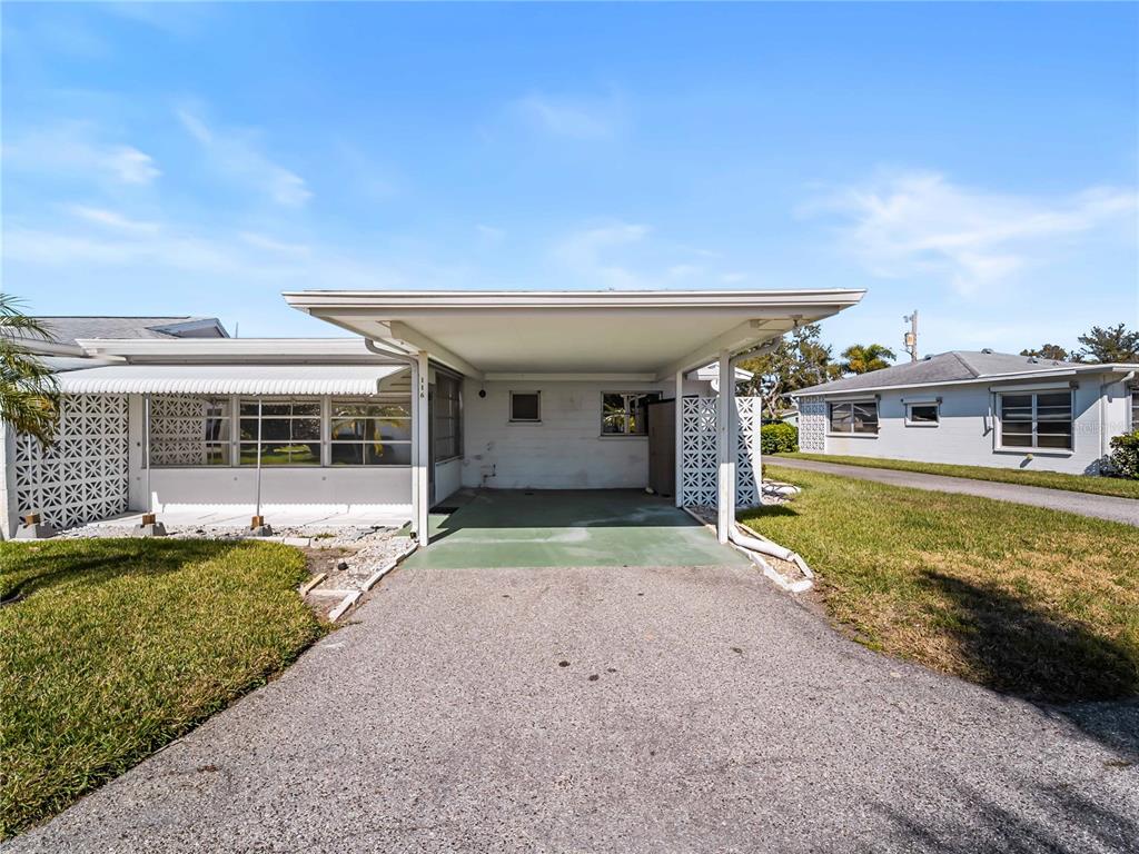 116 The Corso, Unit 116 Venice, FL 34285 - Photo 26 of 36 a view of a house with a swimming pool
