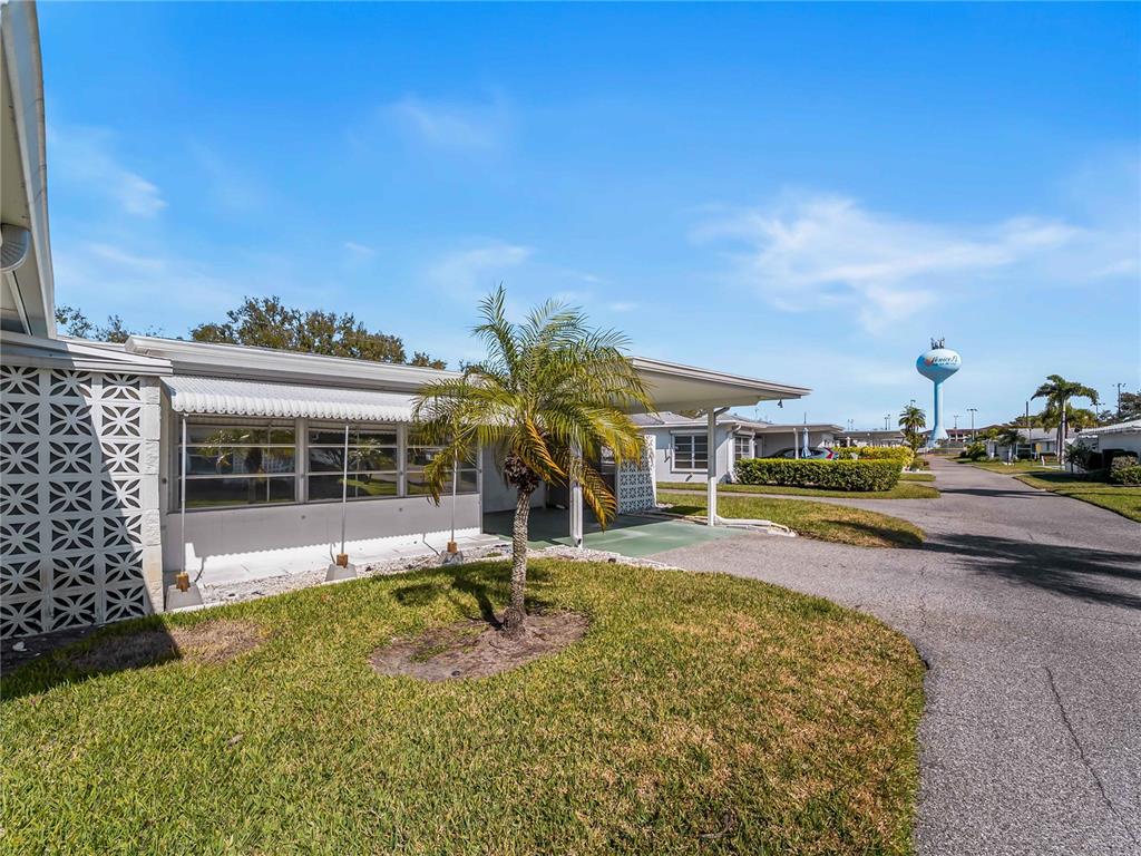116 The Corso, Unit 116 Venice, FL 34285 - Photo 27 of 36 a view of a house with a yard