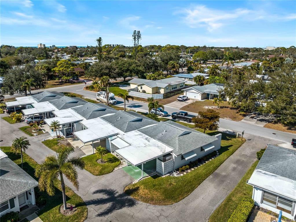 116 The Corso, Unit 116 Venice, FL 34285 - Photo 34 of 36 an aerial view of residential houses with outdoor space