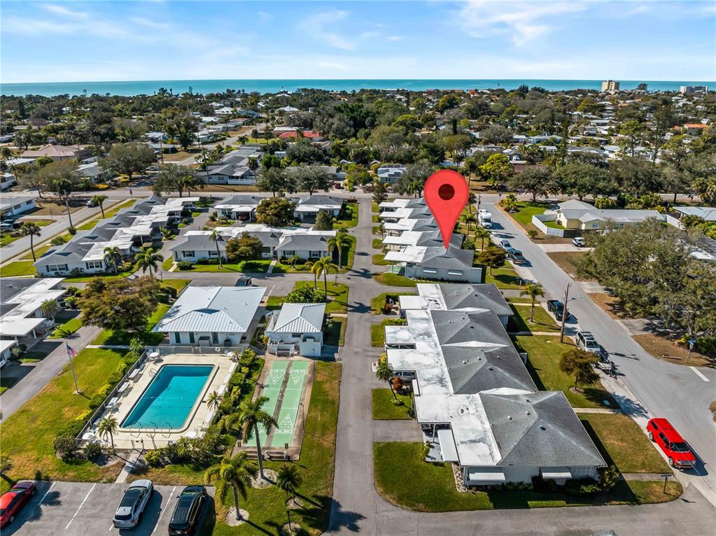116 The Corso, Unit 116 Venice, FL 34285 - Photo 36 of 36 an aerial view of residential houses with outdoor space