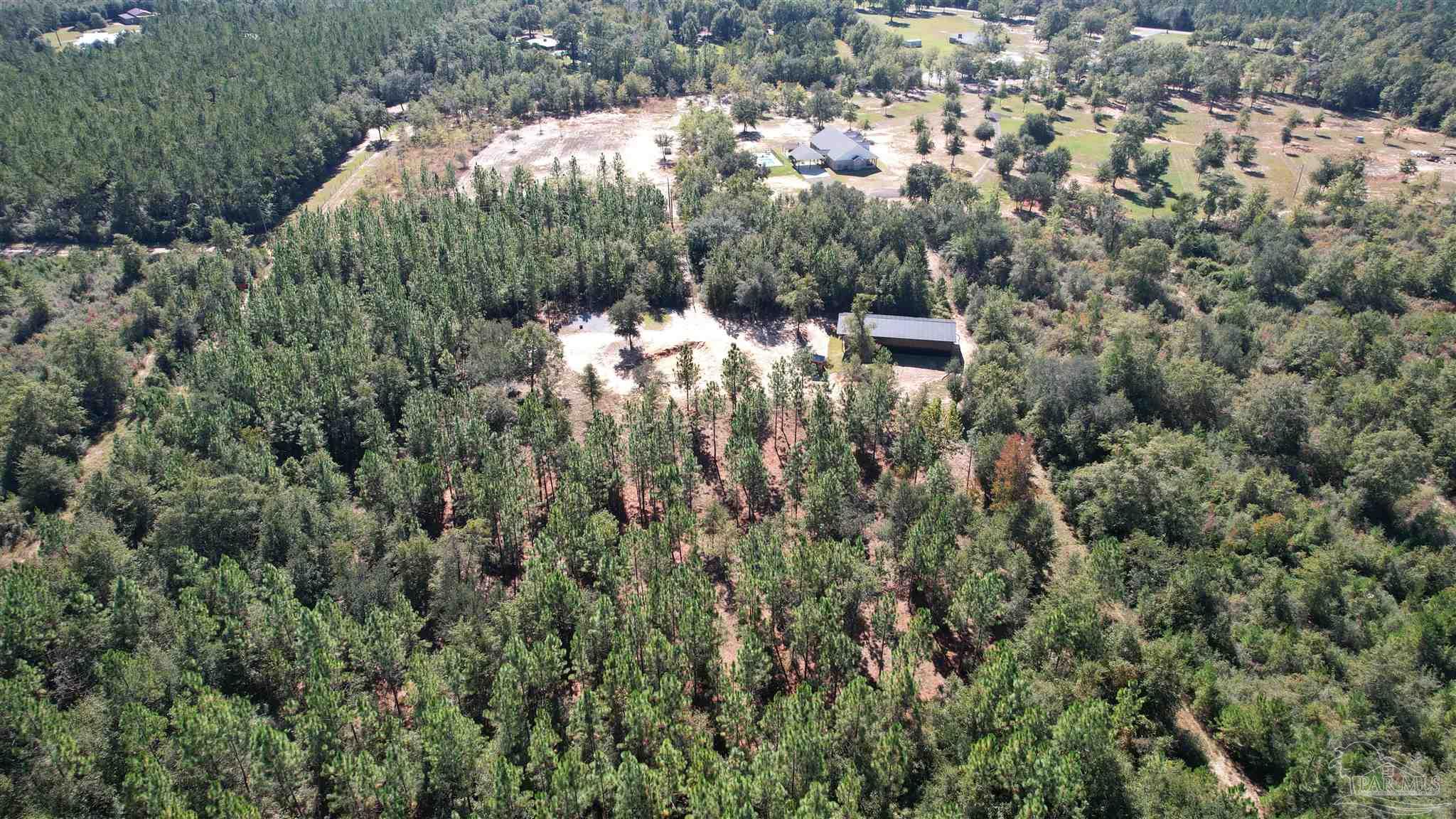 3404 YELLOW HAMMER Road Pace, FL 32571 - Photo 15 of 20 an aerial view of a house with a yard