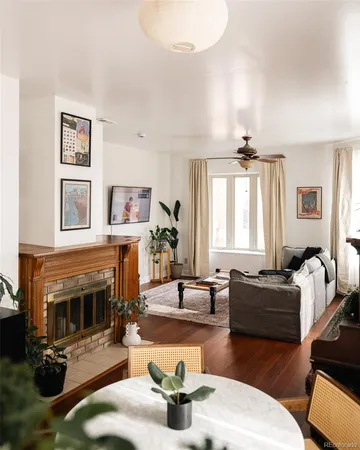 a living room with fireplace furniture and a fireplace