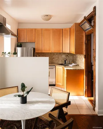 a kitchen with a table and chairs in it