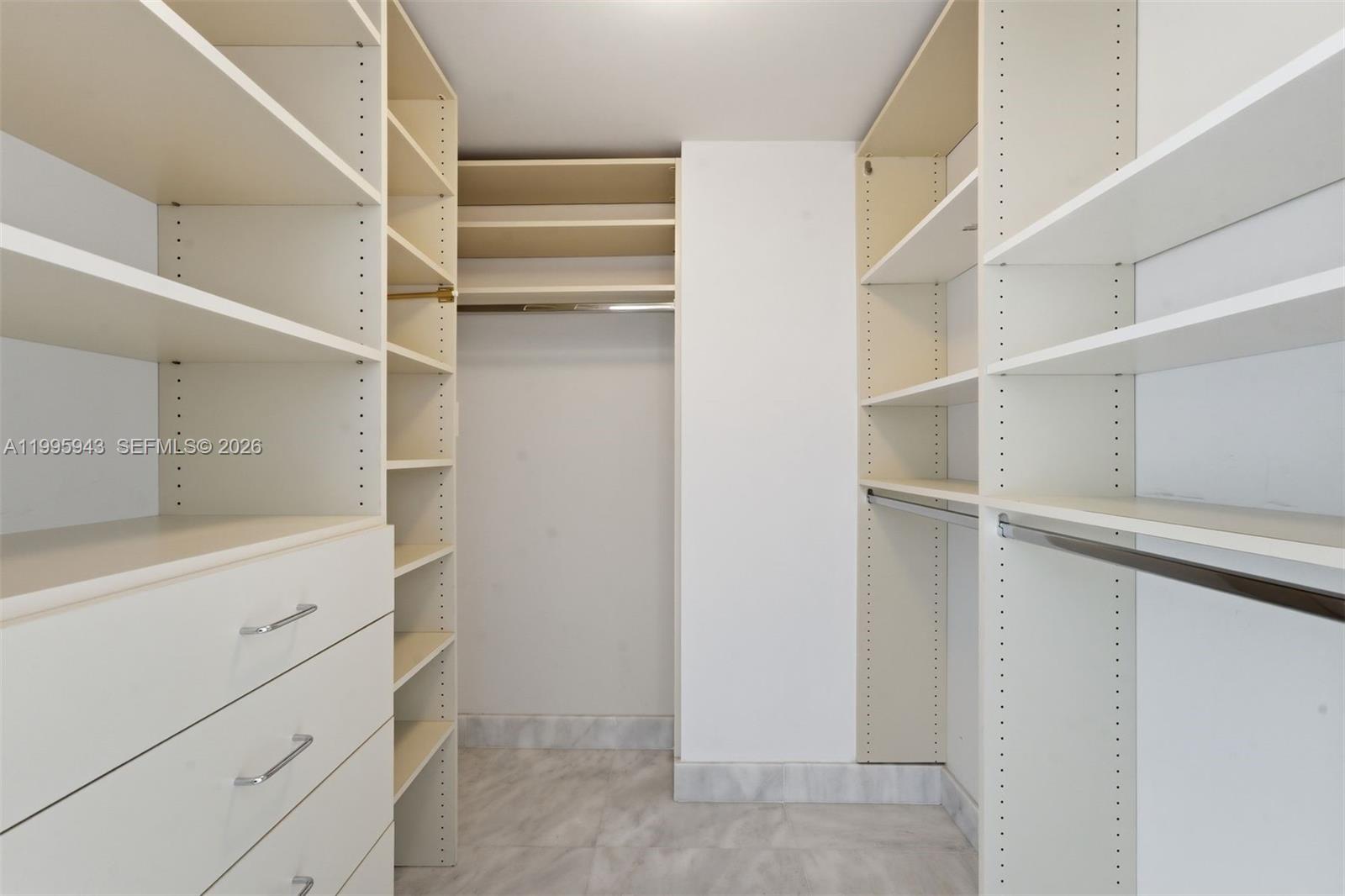 450 Alton Road, Unit 910 Miami Beach, FL 33139 - Photo 29 of 59 a view of walk in closet with empty racks