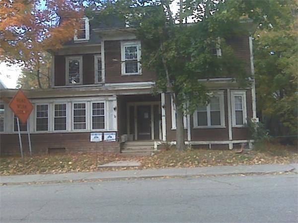268 School Street Athol, MA 01331 - Photo 3 of 5 a front view of a house with a yard and garage