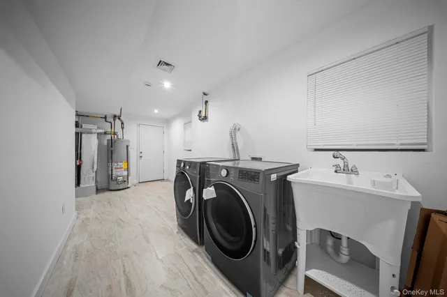 a view of a storage & utility room with washer and dryer