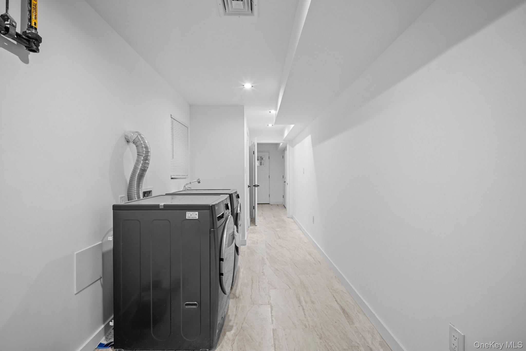 218-37 Spencer Avenue Queens, NY 11427 - Photo 19 of 31 Laundry room featuring recessed lighting and separate washer and dryer