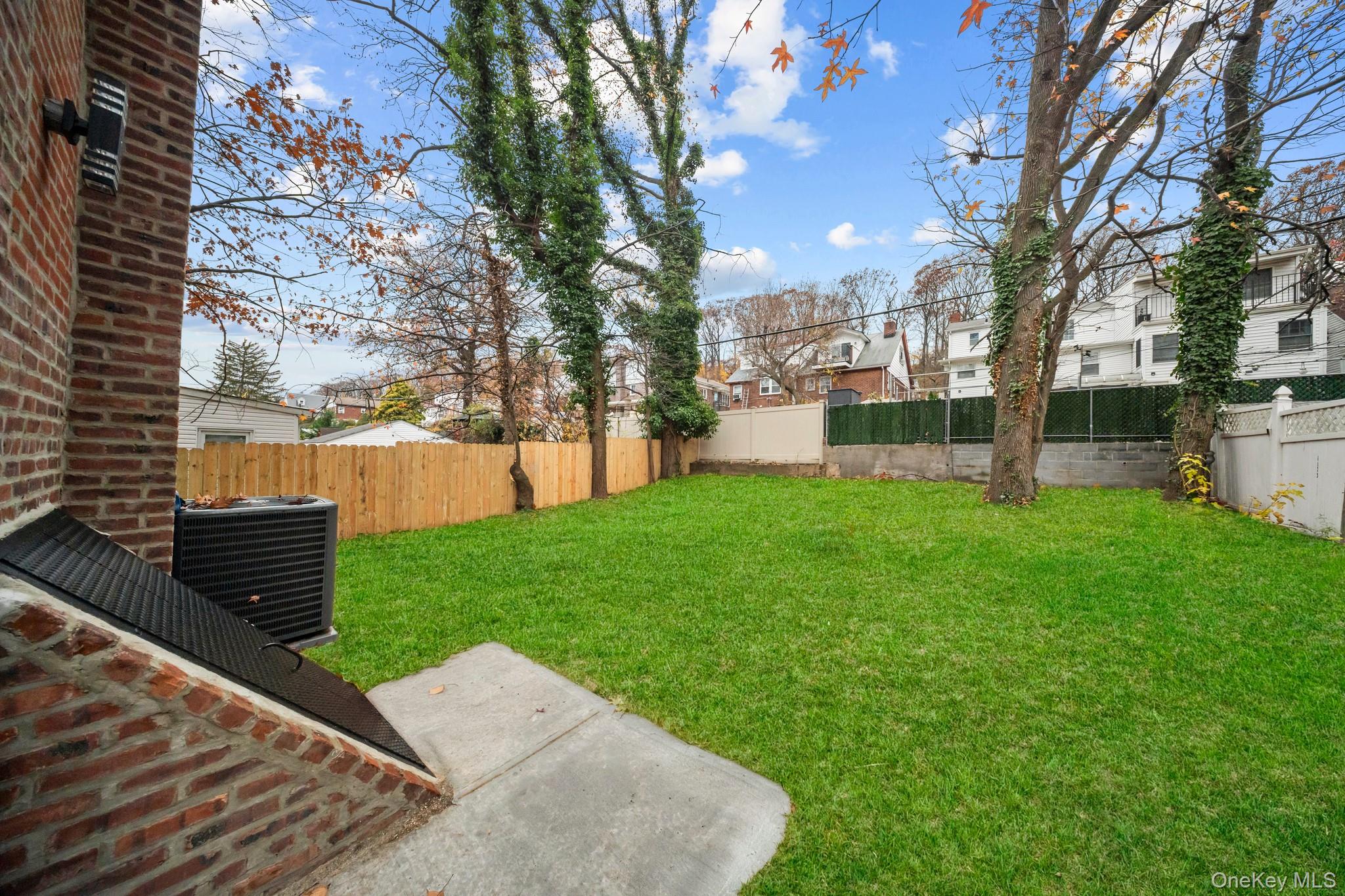218-37 Spencer Avenue Queens, NY 11427 - Photo 30 of 31 Fenced backyard featuring a residential view