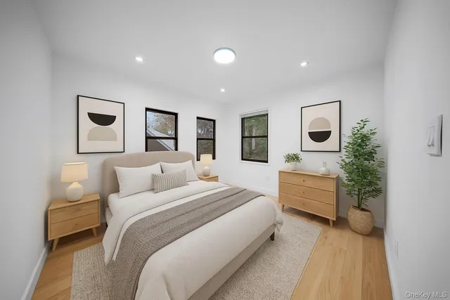 a bedroom with a large bed and a couch