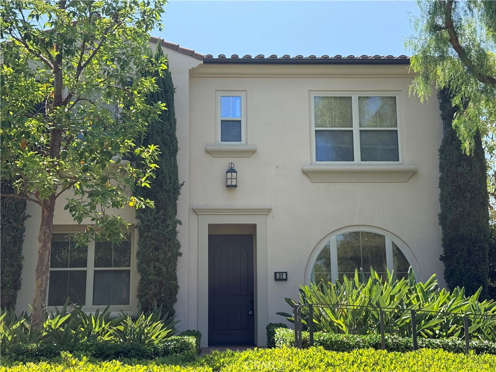 32 Ovation Irvine, CA 92620 - Photo 2 of 18 a front view of a house with plants