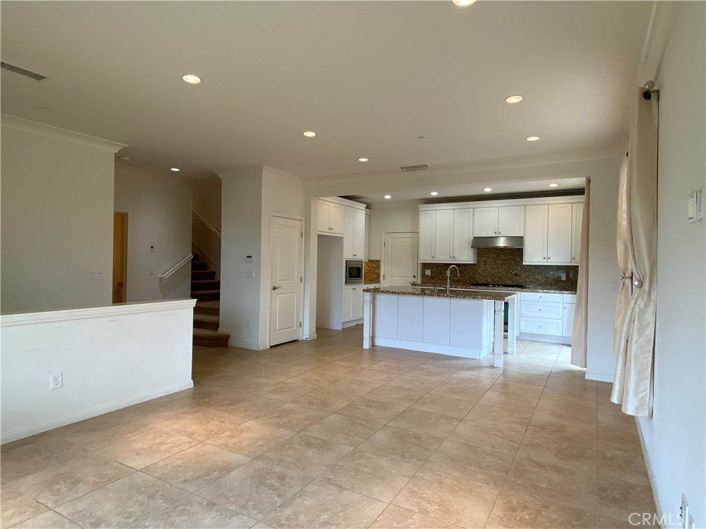 32 Ovation Irvine, CA 92620 - Photo 4 of 18 a view of kitchen with refrigerator sink and a counter top space