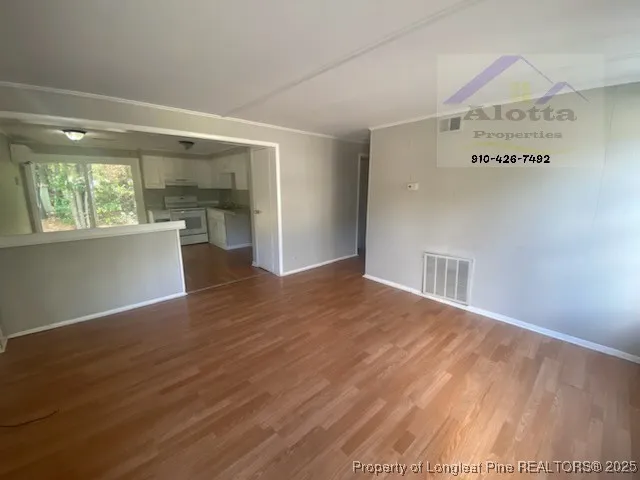 a view of livingroom with furniture and wooden floor