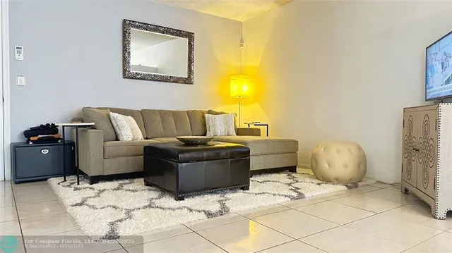 a living room with a couch and a fireplace