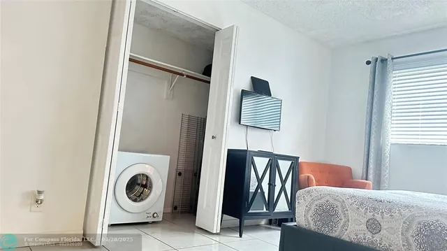a utility room with washer and dryer