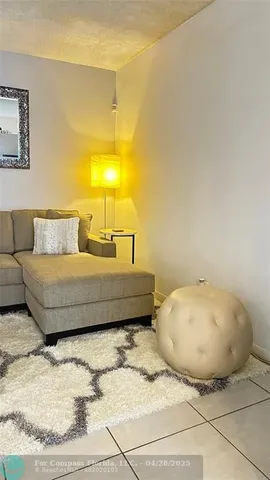 a bedroom with a bed and lamp