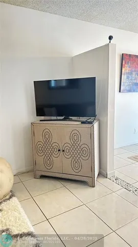 a view of a dining room with furniture and window