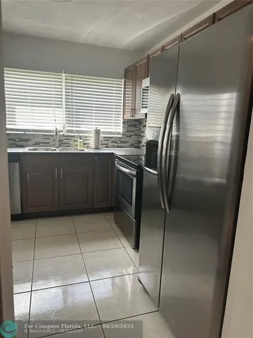 a bed room with a bed and a chair