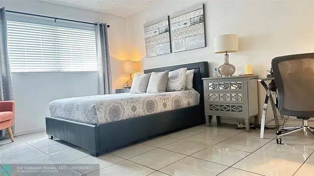 a room with a mirror and furniture