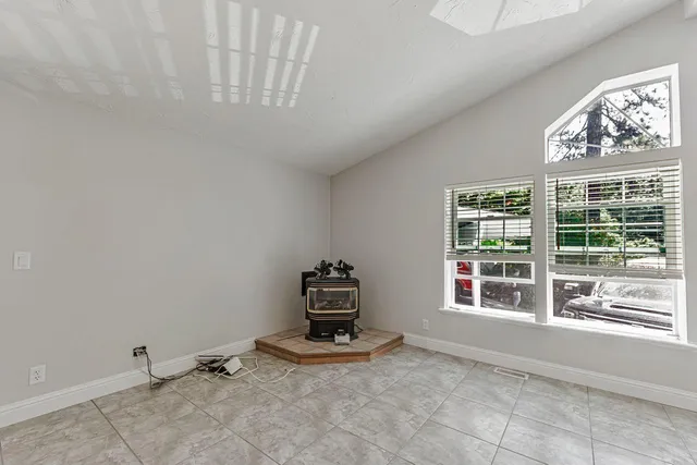 a kitchen with granite countertop a sink cabinets stainless steel appliances and a counter space