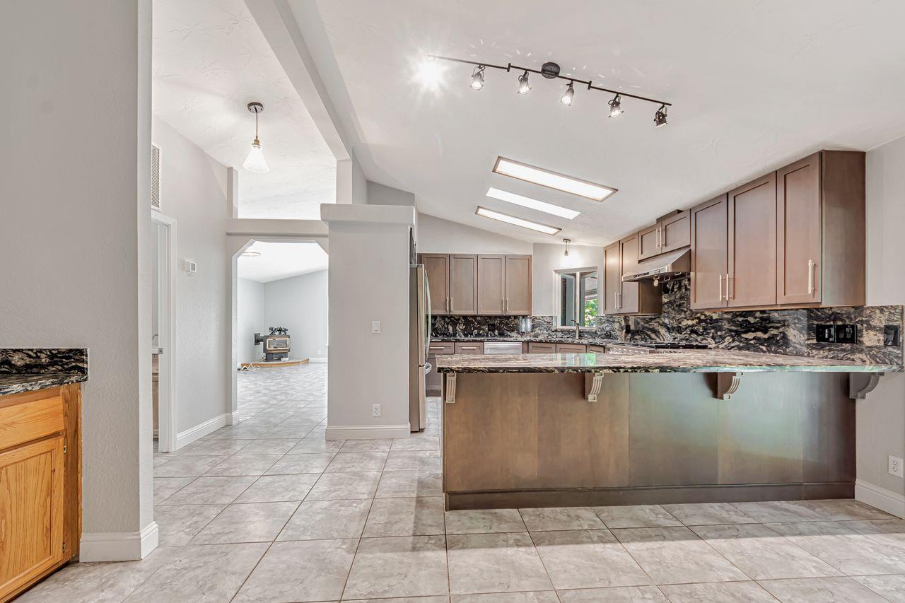 571 B Lane Applegate, CA 95703 - Photo 29 of 85 a kitchen with a sink window and cabinets