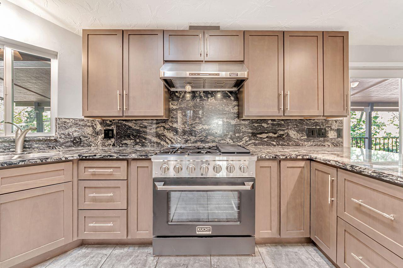 571 B Lane Applegate, CA 95703 - Photo 33 of 85 a kitchen with granite countertop white cabinets and white stainless steel appliances