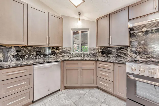 a view of a room with wooden floor and windows