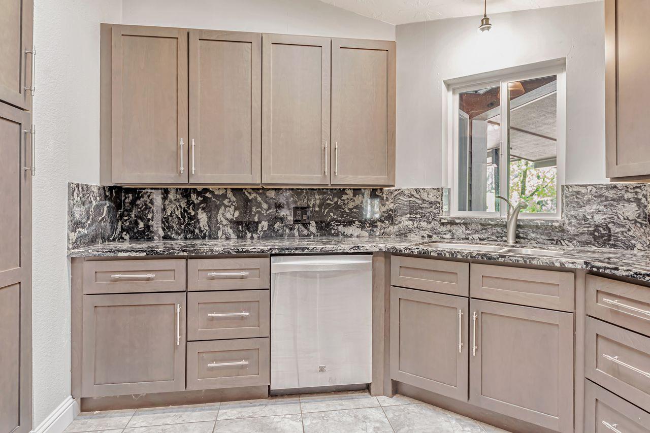 571 B Lane Applegate, CA 95703 - Photo 35 of 85 a kitchen with white cabinets and sink