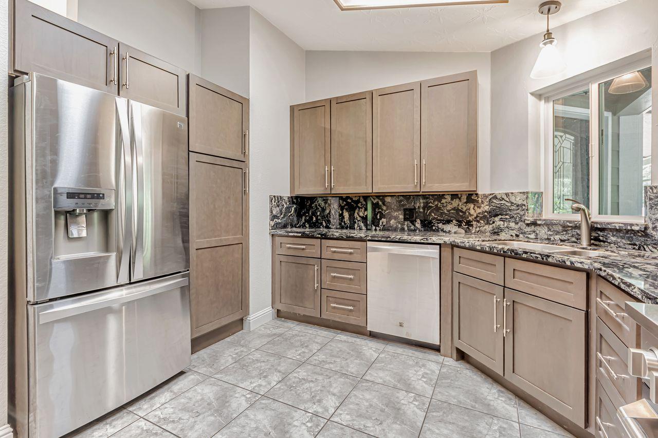571 B Lane Applegate, CA 95703 - Photo 36 of 85 a kitchen with a refrigerator sink and cabinets