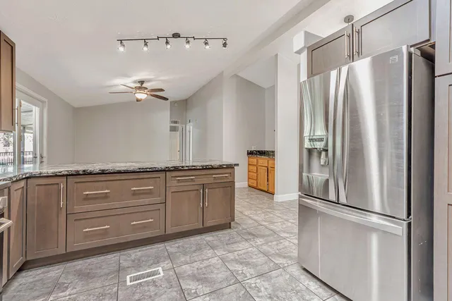 a bathroom with a tub and a window
