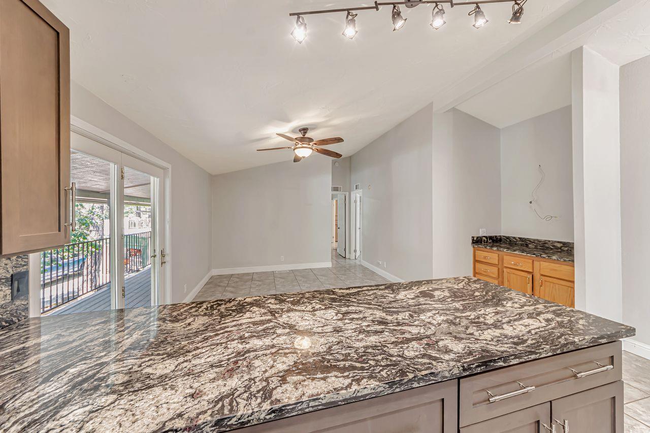 571 B Lane Applegate, CA 95703 - Photo 38 of 85 a view of a kitchen with granite countertop sink and natural light