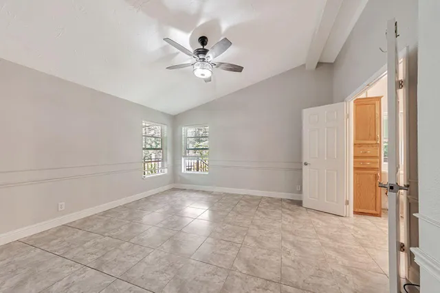 a view of a hallway with stairs
