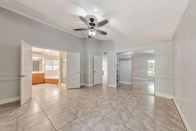 a view of a porch with wooden floor and furniture