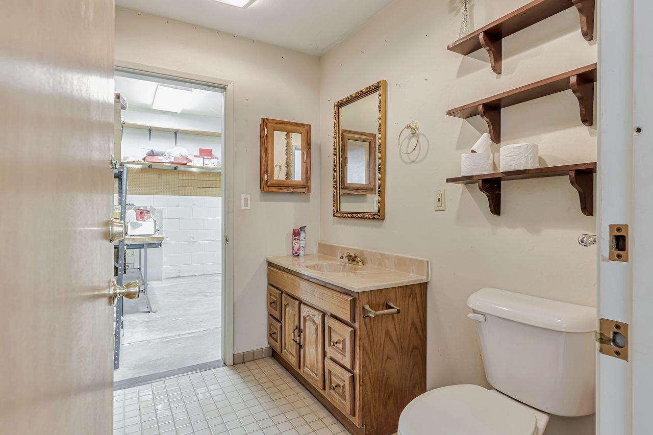 571 B Lane Applegate, CA 95703 - Photo 60 of 85 a bathroom with a toilet a sink and mirror